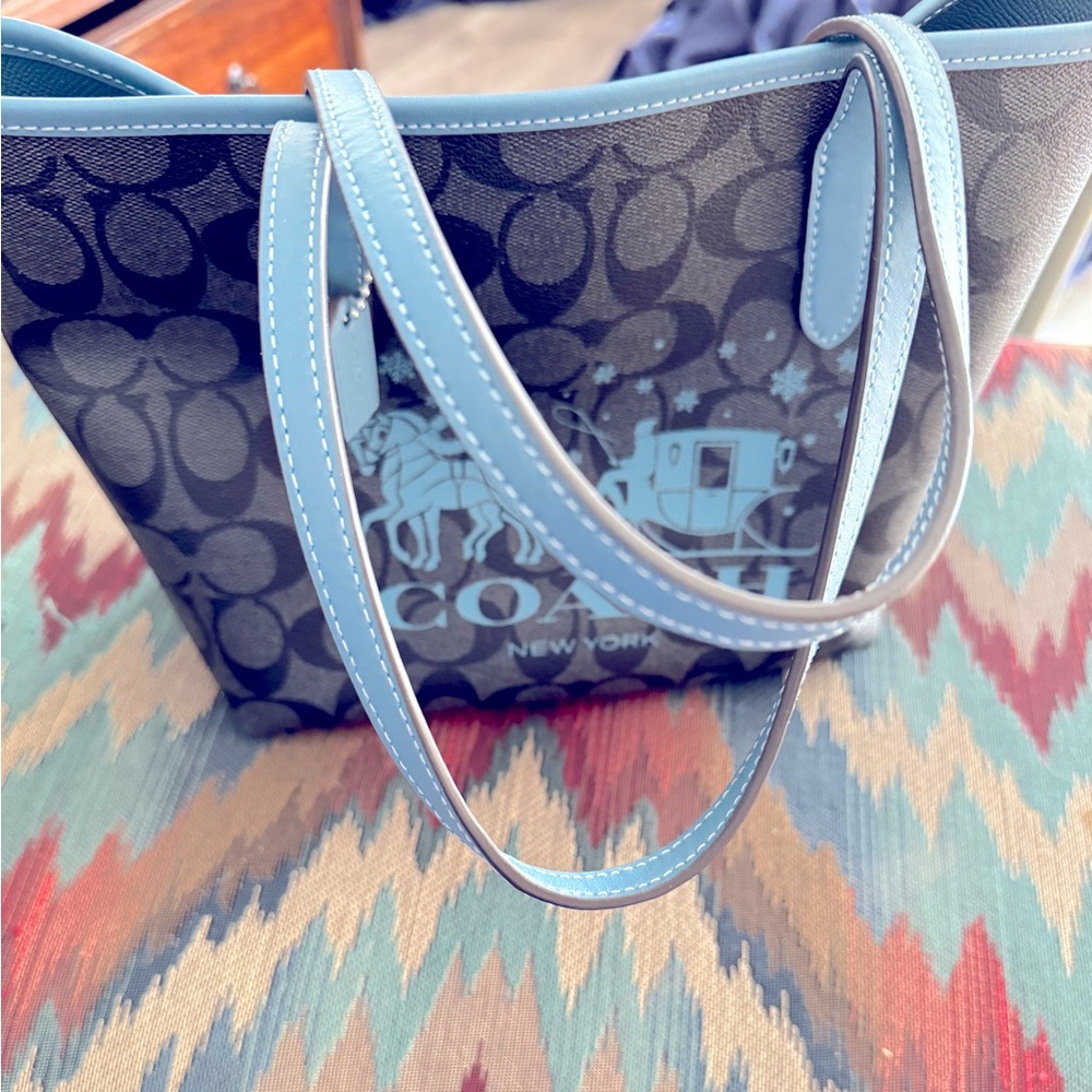 Small Coach NWOT color blue. Only used briefly. Lots of good life left